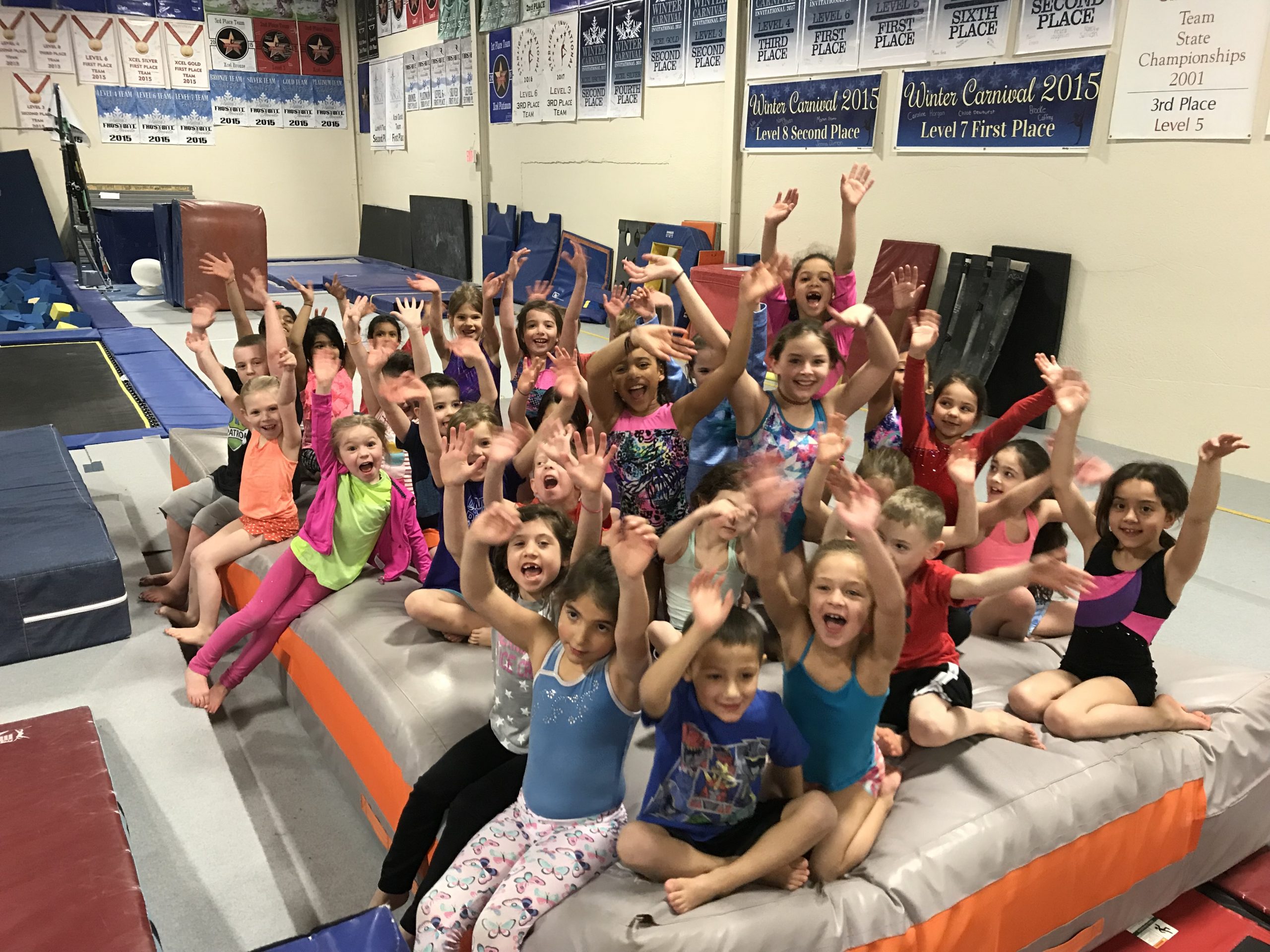 Kids smiling at gymnastics class at Legends Gymnastics in North Andover, MA.