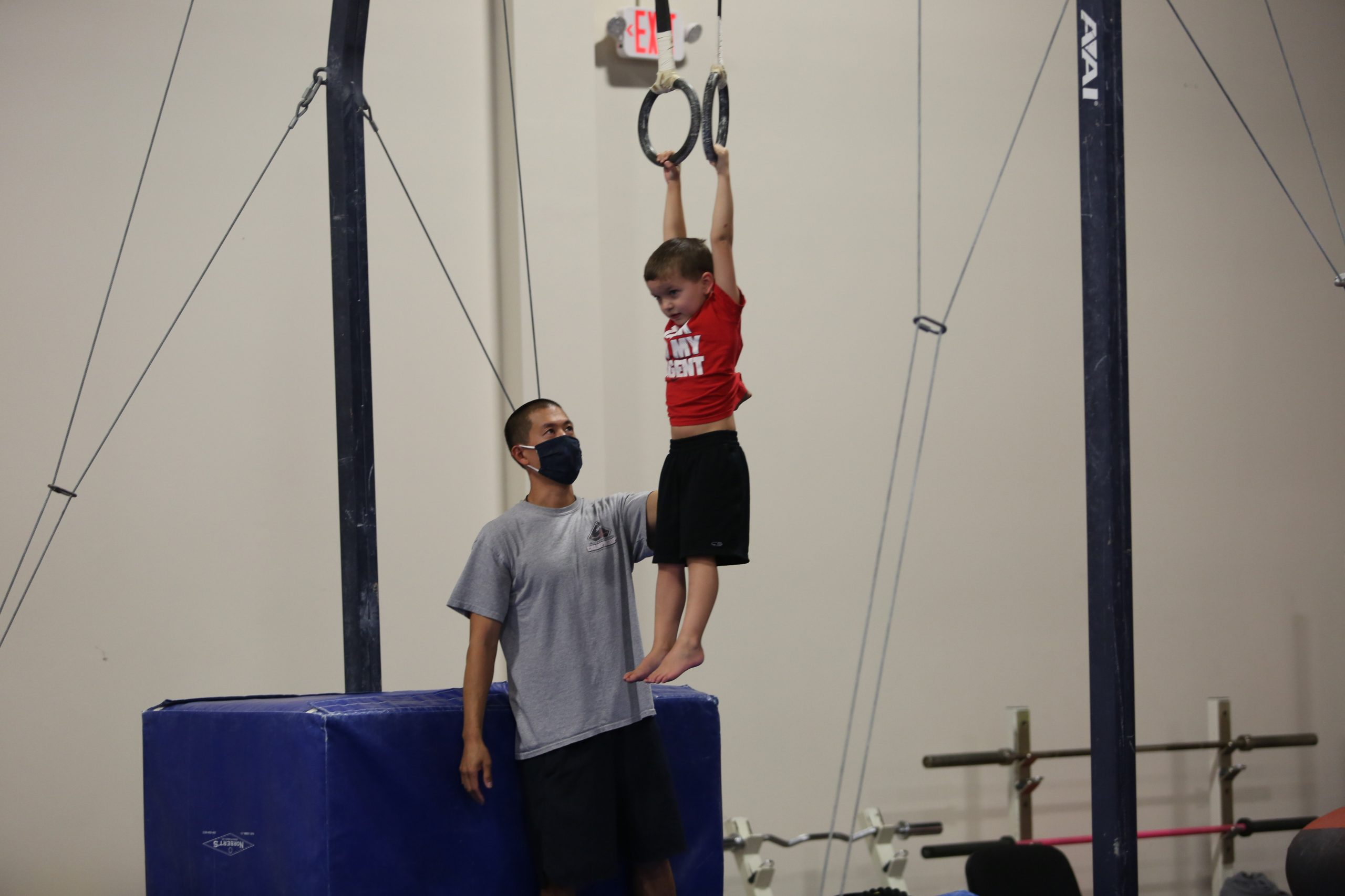 Boy on rings at Legends Gymnastics in North Andover, MA.
